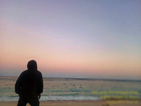 silhouette of man at sunset Wade Lembata Island