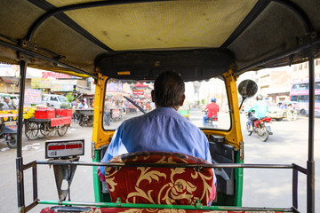 (Passenger point of view) A unidentified driver is riding his auto rickshaw (also known as Tuc Tuc)...