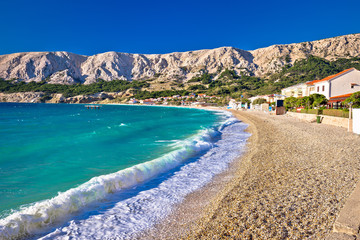 Baska. Idyllic pebble beach with high waves in town of Baska, Island of Krk