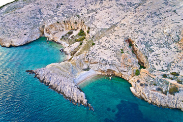 Island of Krk idyllic pebble beach with karst landscape aerial view, stone deserts of Stara Baska