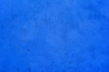 Background of an old concrete wall painted blue with fine texture