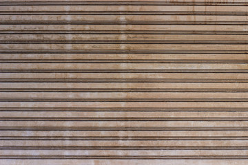 Old roller shutter door metal texture, door garage and factory.