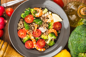 Buckwheat salad with broccoli chicken breast shrimp, Three-color quinoa salad. Superfood and healthy eating concept.