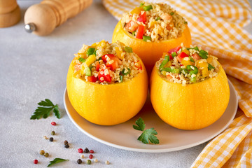 Round zucchini stuffed with bulgur and vegetables. Close up with copy space