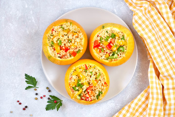 Round zucchini stuffed with bulgur and vegetables. Top view