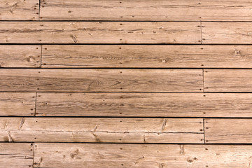 Old wooden floor of crooked boards. Natural wood texture.