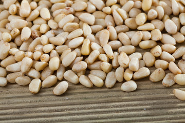 Picture of  wooden desk with raw pine nut, nobody