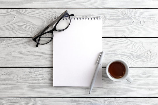 Blank Page On The Office Desk Table, View From Above