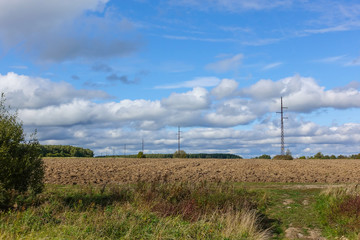 Plowed field and uncultivated land nearby. Agriculture