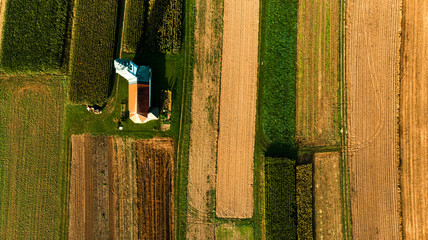 Lonely Chapel on Farm Fields. Abstract Pattern. Top Down Aerial Drone View