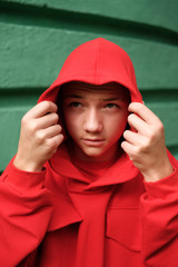 teenage boy in fashionable red hoodie