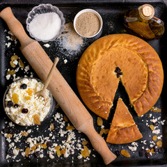 authentic pie on a black background with ingredients
