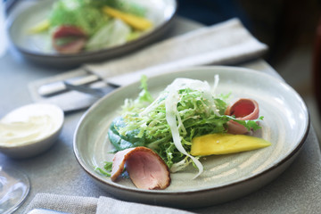 Freshly made duck salad with mango