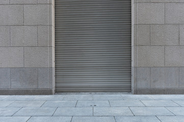 A closeup shot of automatic metal roller door used in factory, storage, garage, and industrial...