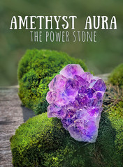 Amethyst aura. the power stone. amethyst druse crystal on natural background. Magic Rock for...