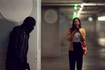 Robber lonely woman in the dark and dangerous