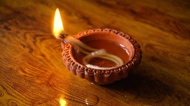 Diwali festival lamp on wooden background