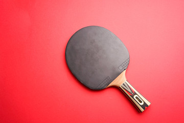 Pingpong bat or table tennis racket on Red background