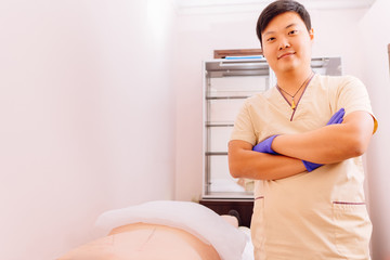 Fototapeta premium Young woman undergoing acupuncture treatment. Traditional Chinese treatment, alternative medicine