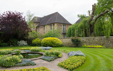 Beautiful english garden in Oxford (United Kingdom, England). Nice old stone house in the...