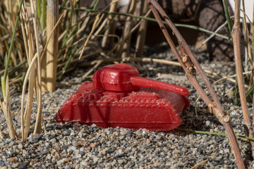 plastic toy war tank in combat field, plastic toy, small toy, small toy combat tank