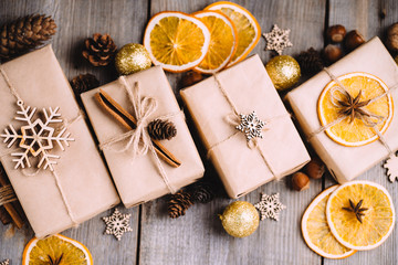 Christmas scene. Holiday greeting card design. Traditional gingerbread cookies, handmade gift boxes and festive decorations