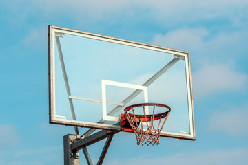Basketball hoop on a blue sky