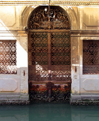 Details of old Venetian door on canal, Venice- Italy