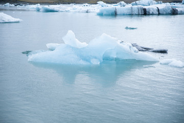 Icebergs in the Jökulsárlón glacier lake in Iceland in winter. Photographed at cloud.