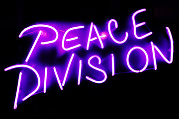 Naklejka na ściany i meble Neon sign of a peace division on dark background