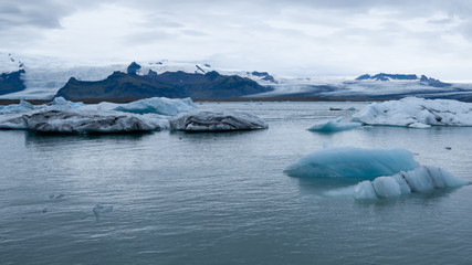 Icebergs in the Jökulsárlón glacier lake in Iceland in winter. Photographed at cloud.