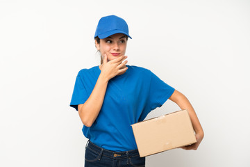 Young delivery girl over isolated white background thinking an idea