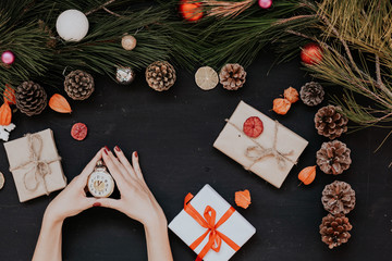 Christmas background new year gifts hands toys balls fruits nuts