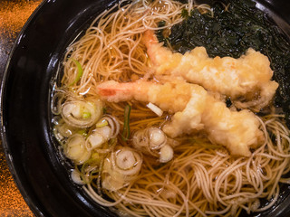 Close up front view of delicious shrimp tempura somen with seaweed and Japanese onions (Japanese noodles)