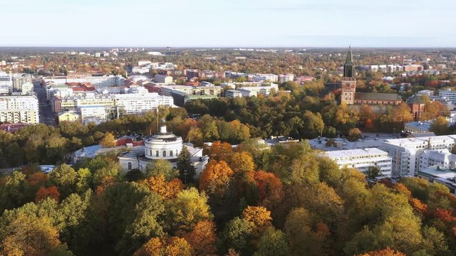 4K UHD aerial view of fall color on vartiovuori hill and Turku, Cathedral on the background in Turku, Finland