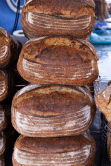 Freshly baked sourdough bread on a food market stall
