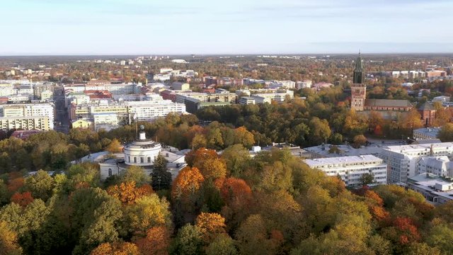 Panoramic aerial footage of Turku city center at autumn with Cathedral of Turku and Vartiovuori Hill, Finland