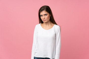 Fototapeta premium Young woman over isolated pink background with sad and depressed expression