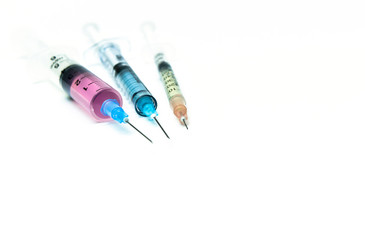 Close up of syringes on the white background. Drug combination therapy for synergistic effect. 