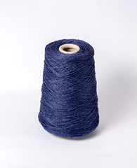 bobbin of yarn on a white background. Side view.Textile reel on isolated white background.