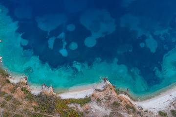 Top view aerial photo of ocean seashore with beautiful color from flying drone. Wonderful seascape with copy space for advertising text message. Perfect background for travel website Horizontal photo.