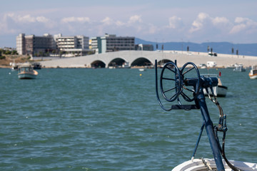 Close-up of reel pull reel behind boat. - Powered by Adobe