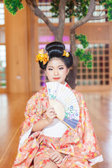 Young women wearing traditional Japanese Kimono at Japanese castle