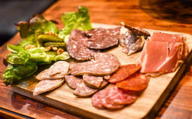 Closeup of charcuterie board with various cold cut meats; prosciutto, salami and liver pates. Restaurant in Andorra -Image