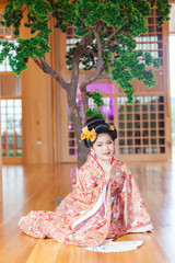 Young women wearing traditional Japanese Kimono at Japanese castle