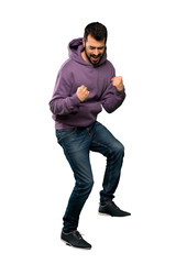 Naklejka premium Handsome man with sweatshirt jumping