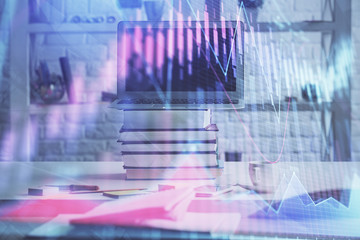 Obraz premium Stock market chart hologram drawn on personal computer background. Double exposure. Concept of investment.