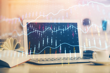 Forex Chart hologram on table with computer background. Double exposure. Concept of financial markets.