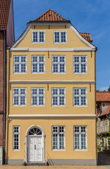 Fototapeta na wymiar Historic yellow house at the waterfront of Flensburg, Germany