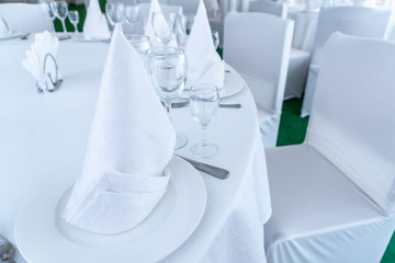 Served banquet table with empty dishes.